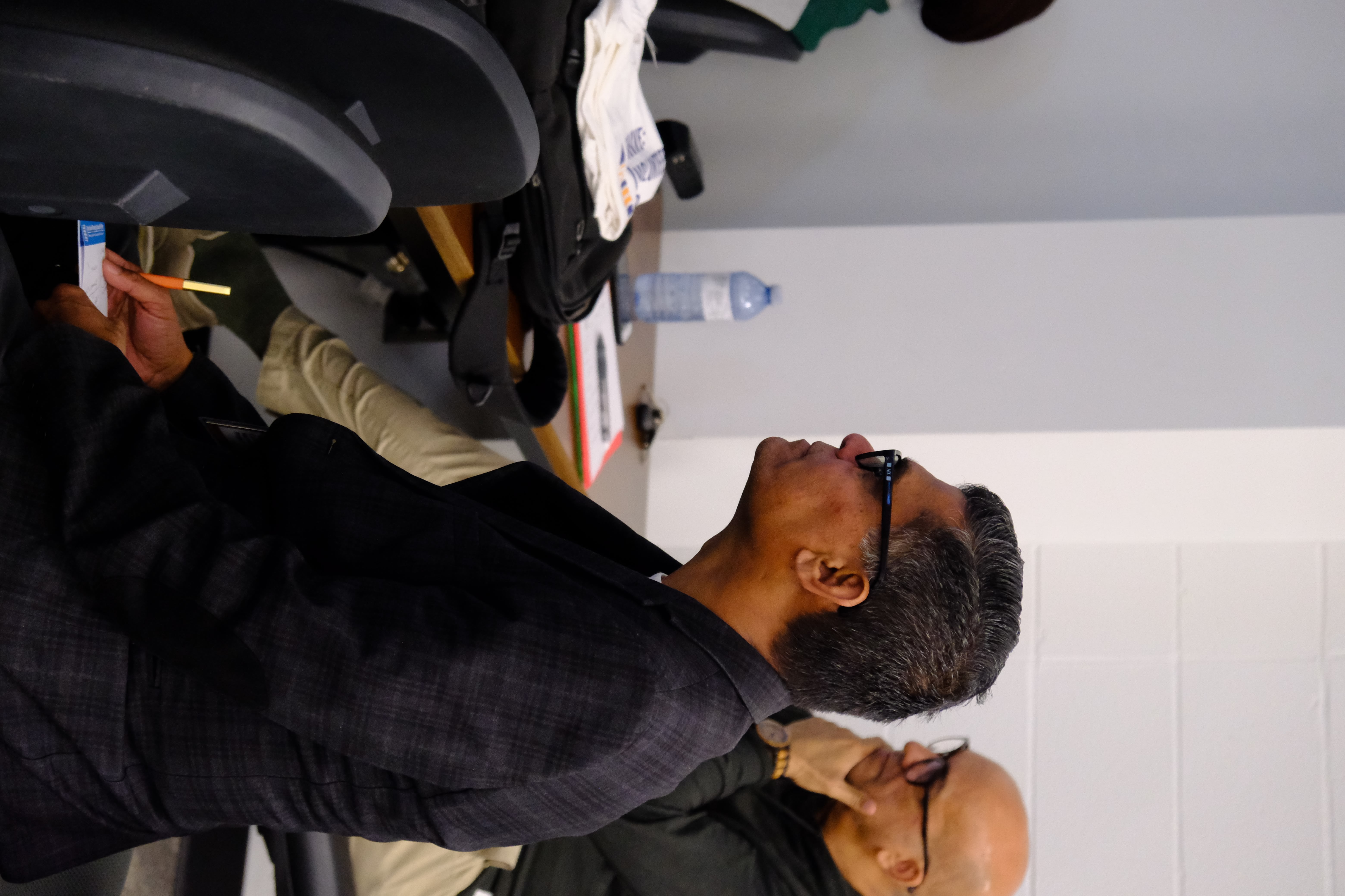 A closeup picture of SPCP CEO and a board member listening attentively to the Facilitator during the Learning How to Practice Community Workshop with Dr. Bethany Osborne on June 3, 2025