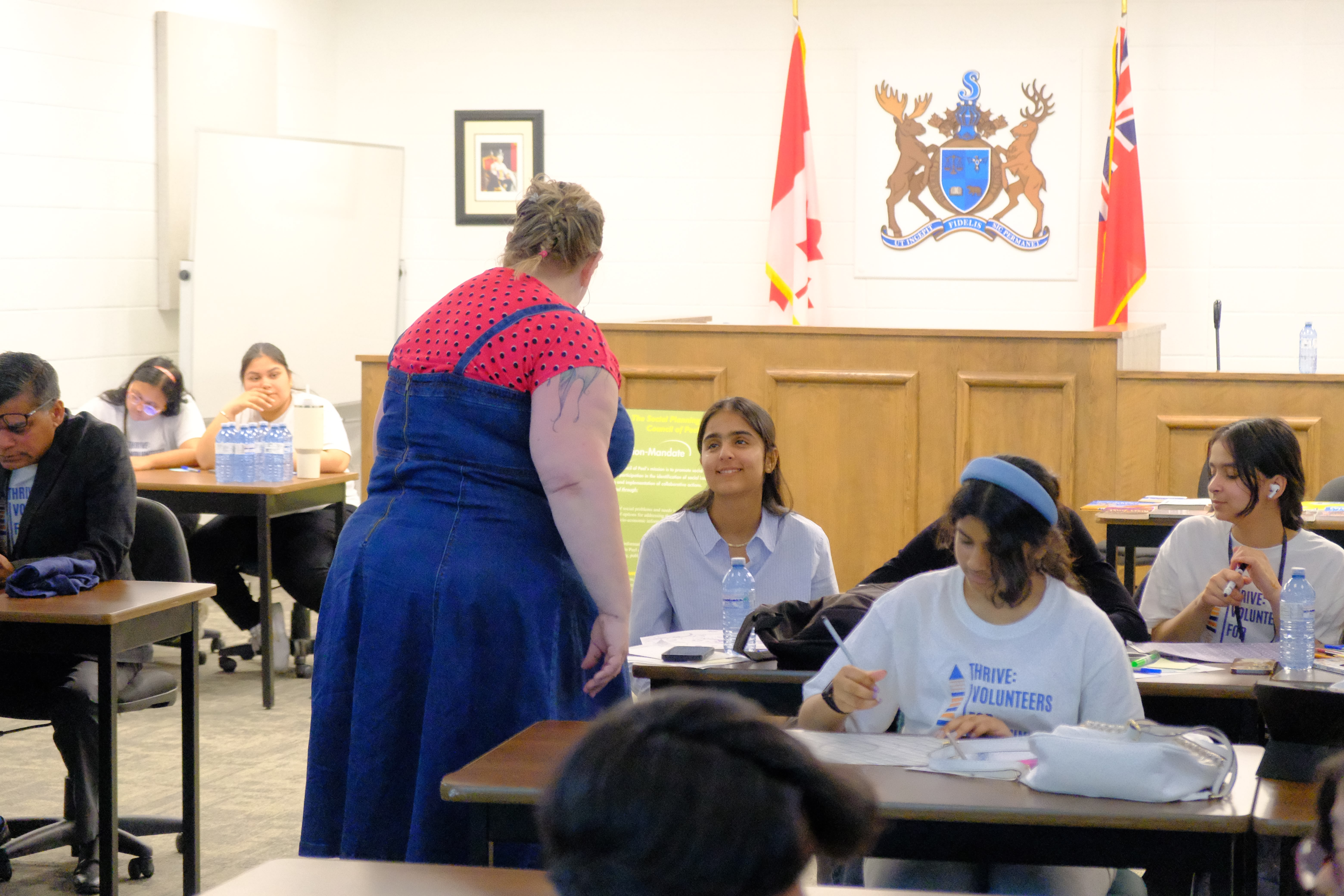 A picture of the Facilitator interacting with a youth during the Learning How to Practice Community Workshop with Dr. Bethany Osborne on June 3, 2025
