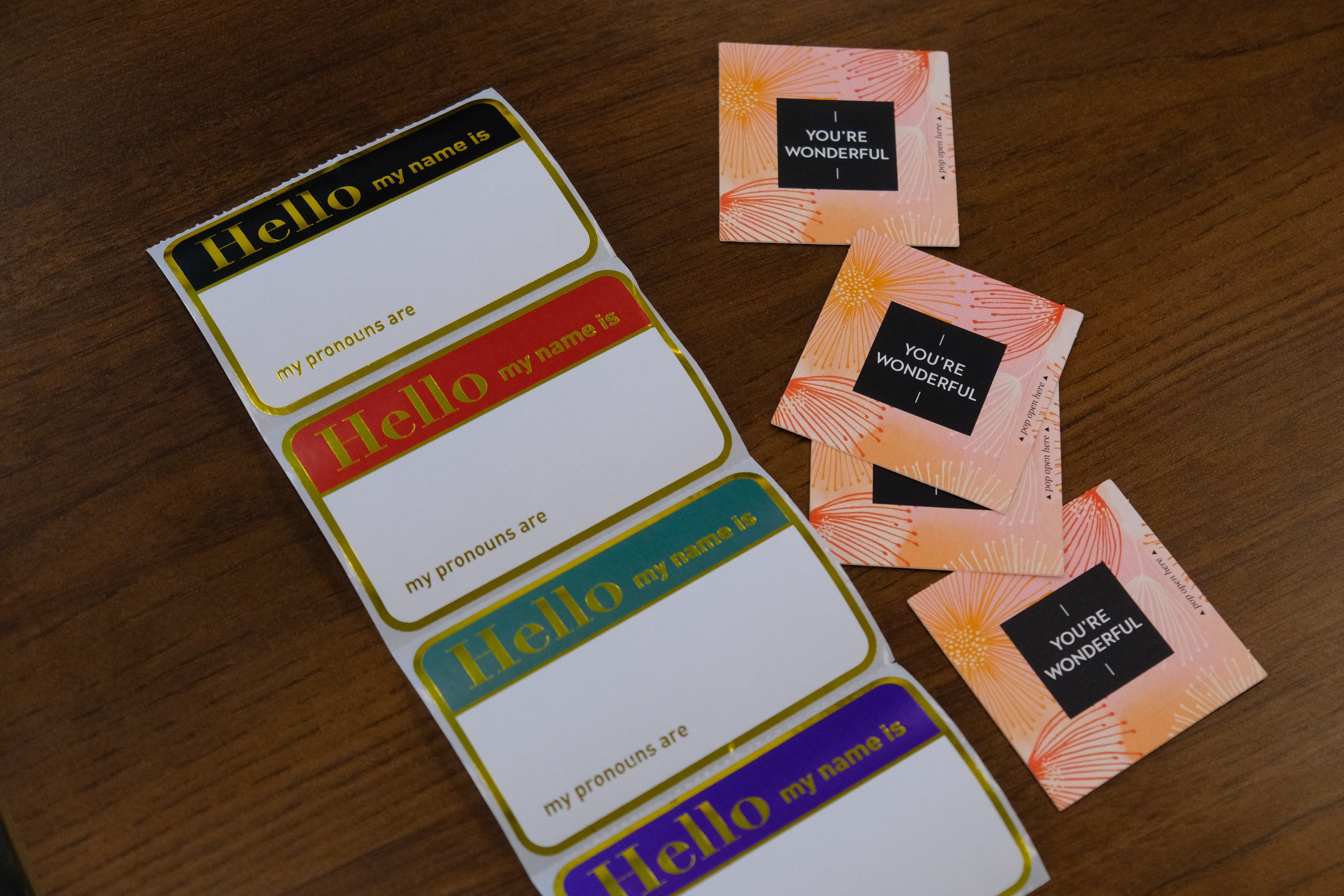 A picture of various name tags on a table to be used by the youth during the Mental & Physical Wellness Workshop with Nicole Johnson on May 27, 2025