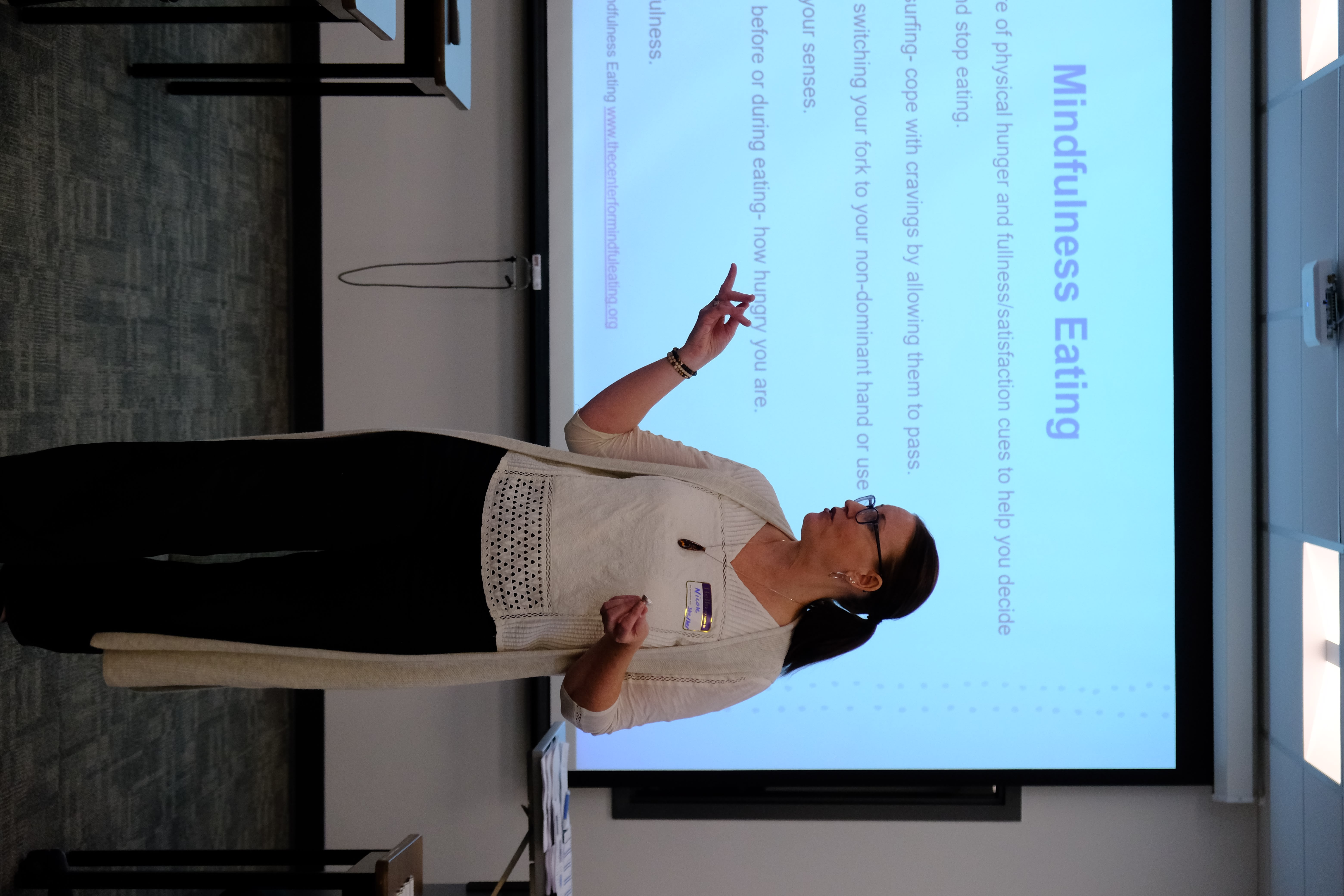 A closeup picture of the Facilitator providing lessons during the Mental & Physical Wellness Workshop with Nicole Johnson on May 27, 2025