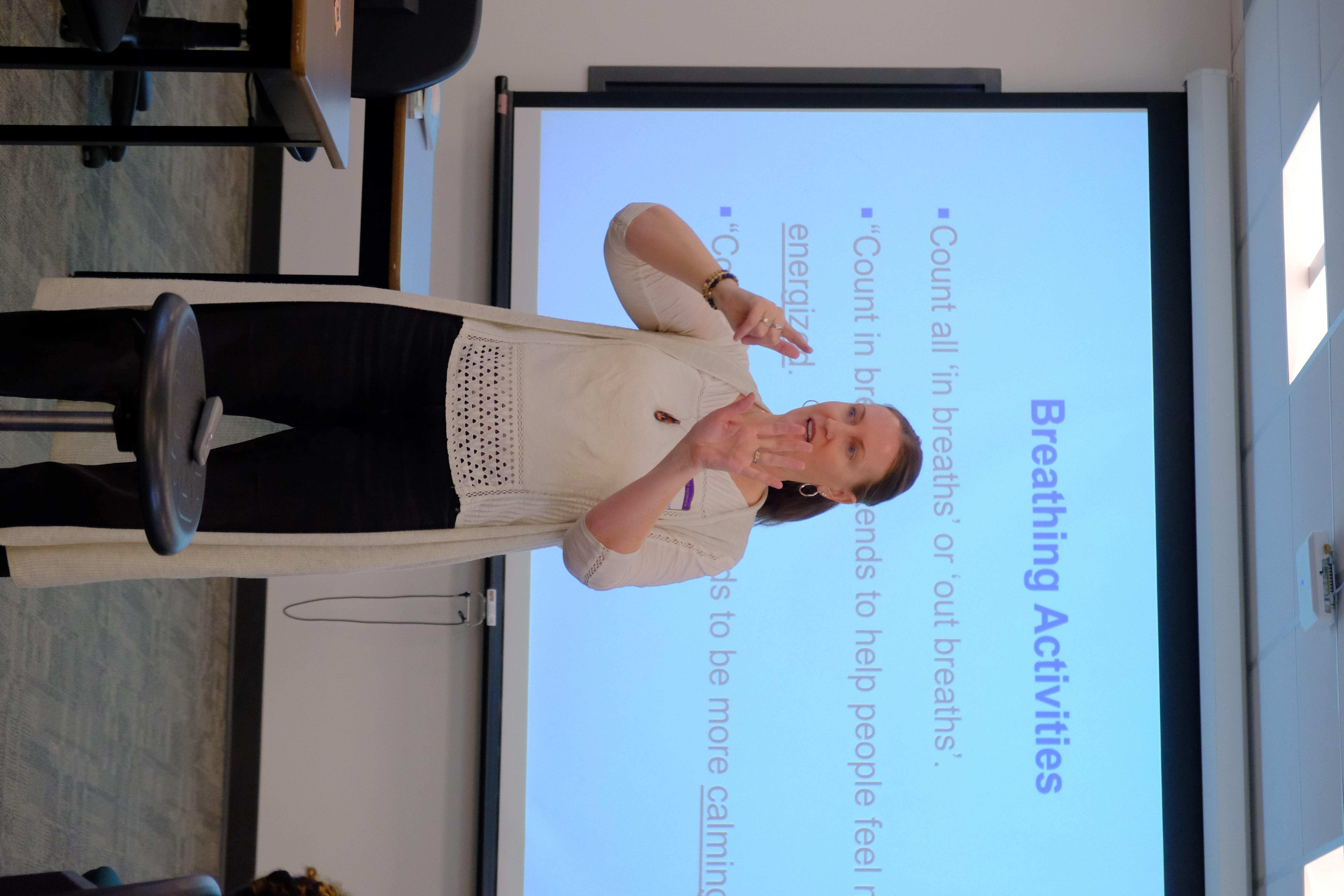 A closeup picture of the Facilitator providing lessons during the Mental & Physical Wellness Workshop with Nicole Johnson on May 27, 2025