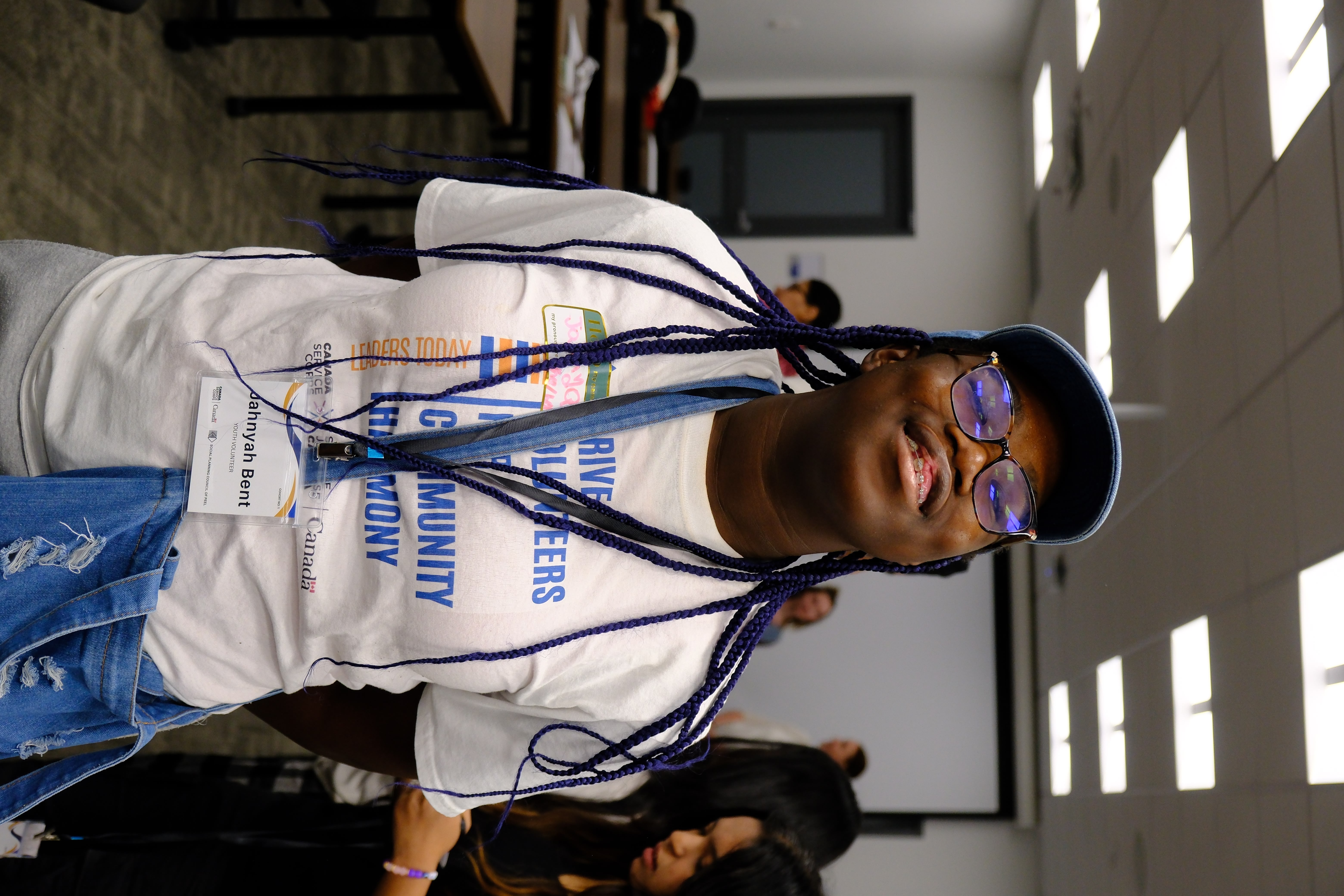 A closeup picture of a youth named Jahnyah Bent who is smiling during the Mental & Physical Wellness Workshop with Nicole Johnson on May 27, 2025