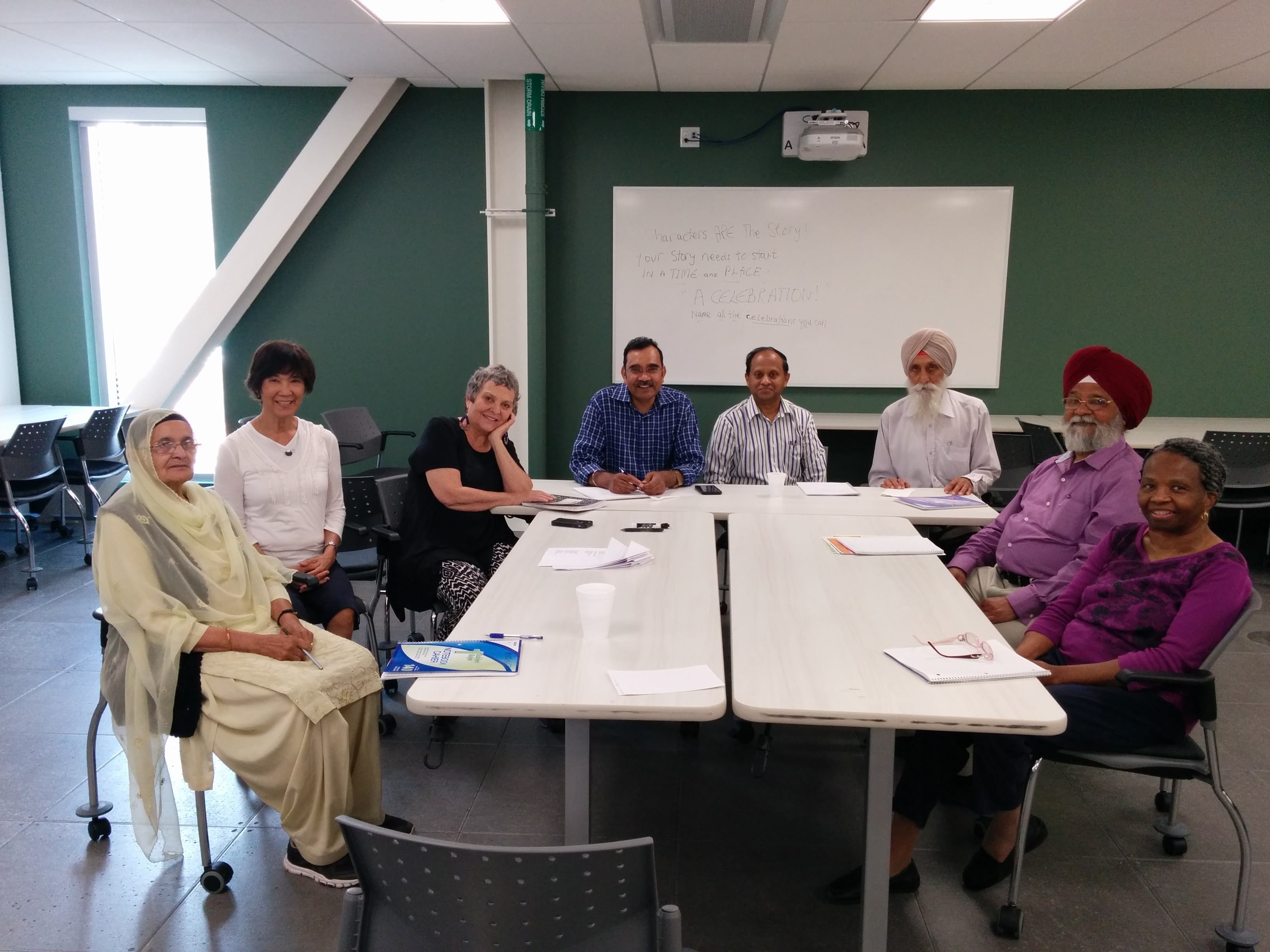 A picture of seniors, a facilitator and SPCP staff/board at a theare-based social wellness workshop.