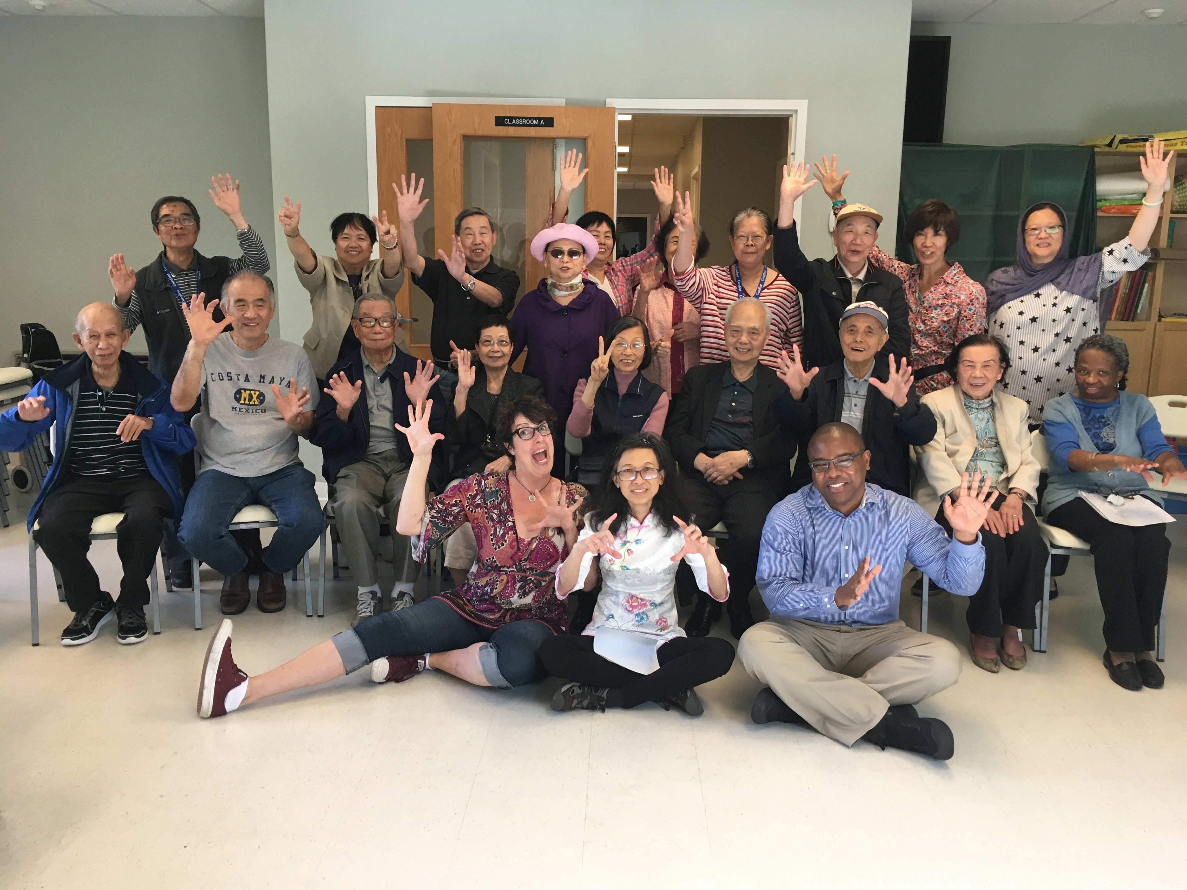 A picture of seniors, a facilitator and SPCP staff at a theare-based social wellness workshop.