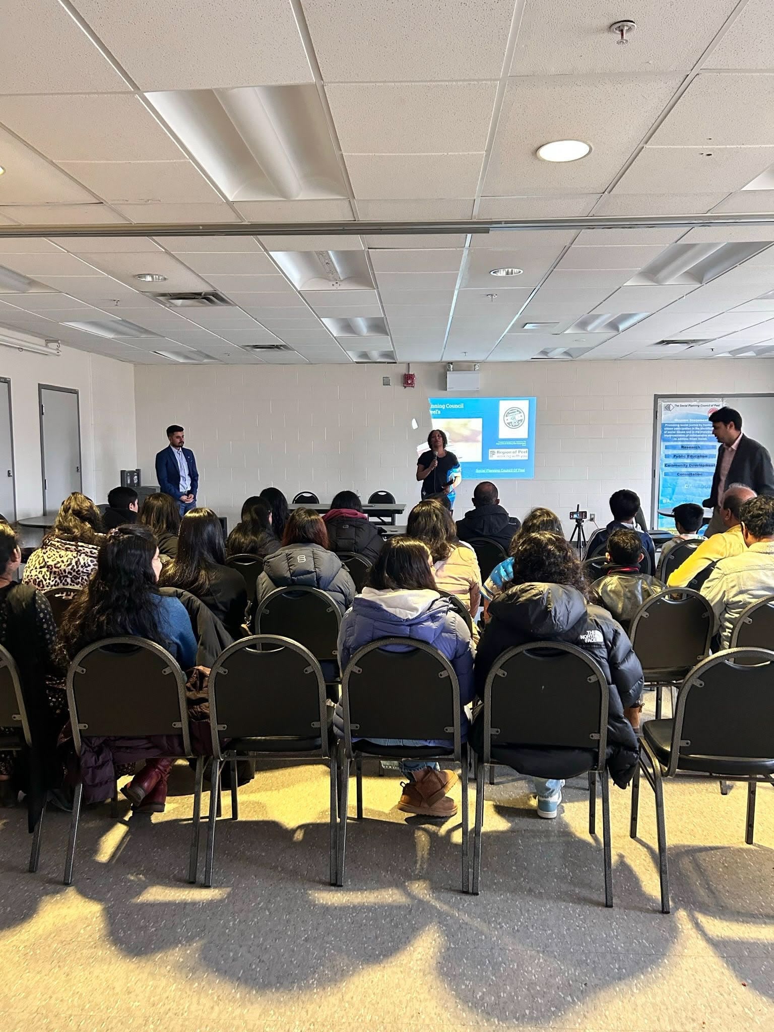 A picture of youths, a facilitator and SPCP placement students at a life skill, mental wellness and safer community workshop.